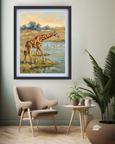 Framed painting of a giraffe in a natural setting above a chair in a room with plants.