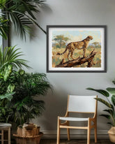 Framed artwork of a cheetah on a branch in a room with plants and a chair.