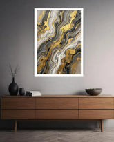 Abstract art print on a wall above a wooden console table.