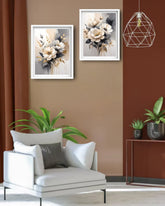 Living room with a white armchair, framed floral art, and decorative plants.