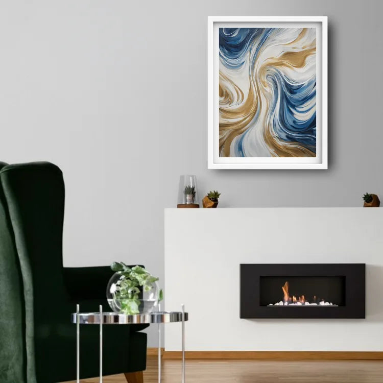 A framed abstract art print with swirling blue, gold, and white patterns, displayed on a light gray wall above a white fireplace mantel in a modern living room setting.