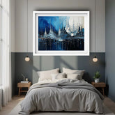 Blue abstract cityscape painting displayed above a modern bed in a stylish interior.