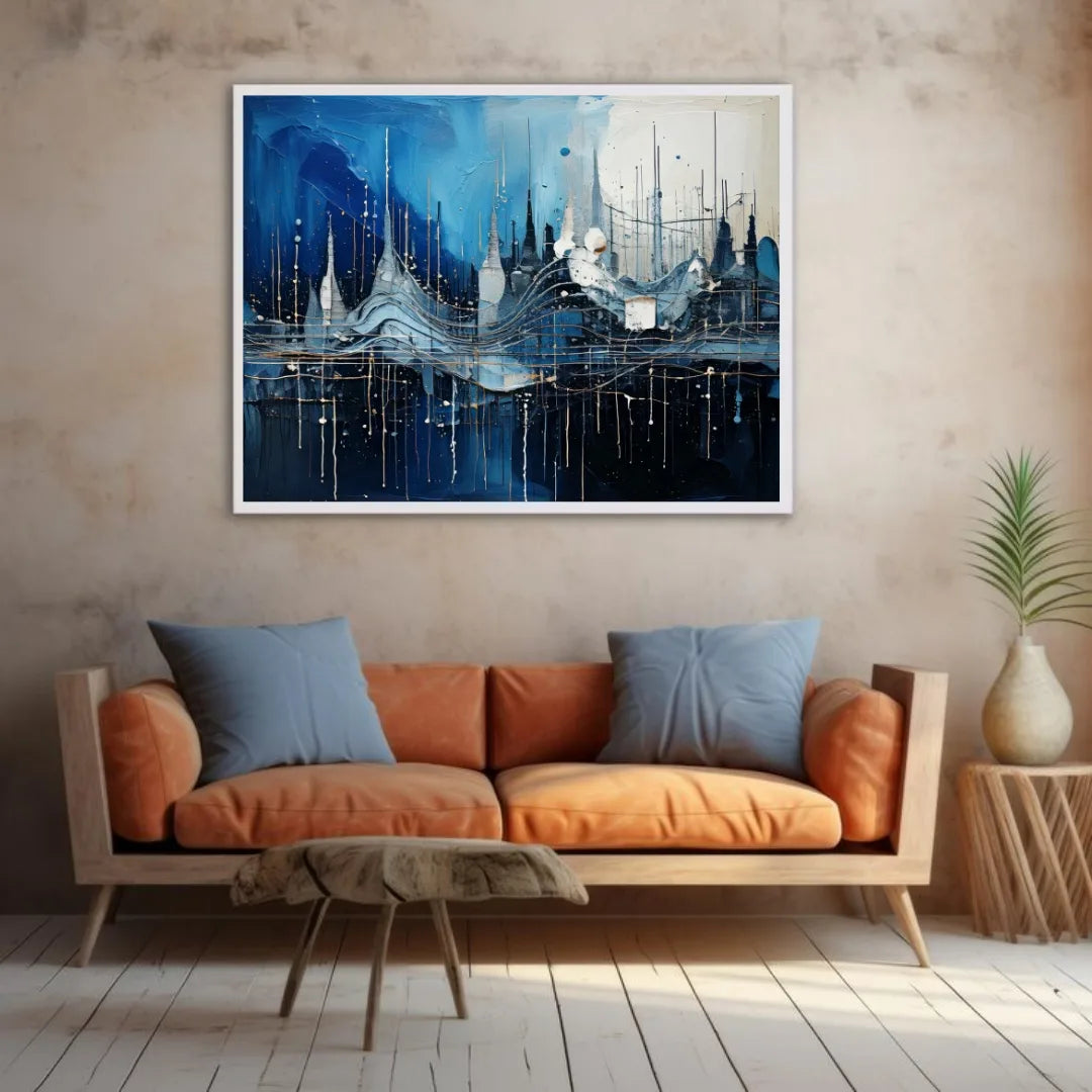 Blue city canvas artwork mounted above an orange sofa in a contemporary home interior.