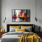 Vibrant cityscape canvas artwork hung in a bedroom with grey walls and modern décor.