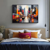 Bright abstract city canvas artwork hung above a bed with contemporary décor.