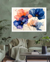 A framed floral wall art print featuring large watercolor-style flowers in blue, coral, purple, and peach on a cream background, displayed above a sofa in a styled living room.