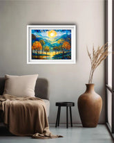 Framed artwork of a sunset over trees in a living room setting with a vase and chair.