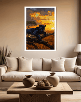 Living room with a couch, coffee table, and wall art of a panther at sunset.