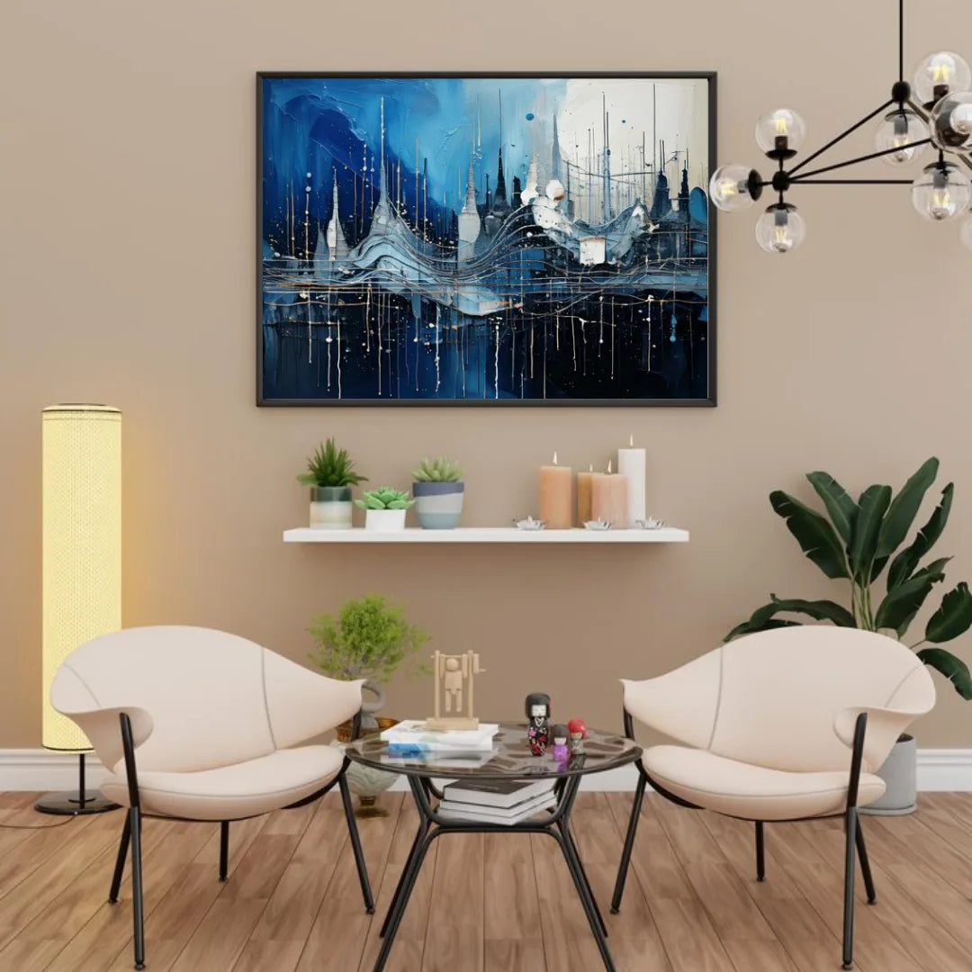 Blue abstract cityscape canvas painting displayed above two modern chairs in a living room.