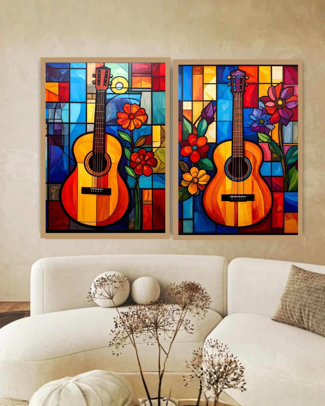 Two colorful wall art pieces of guitars and flowers on a beige wall above a white sofa.