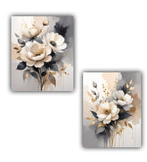 Two floral canvas prints with beige, white, and black flowers on a gray background.