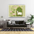 Living room with a gray sofa, decorative rug, and a framed artwork of a cow and lotus flowers on the wall.
