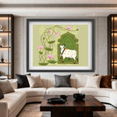 Framed artwork of a cow in a decorative archway on a wall in a living room.