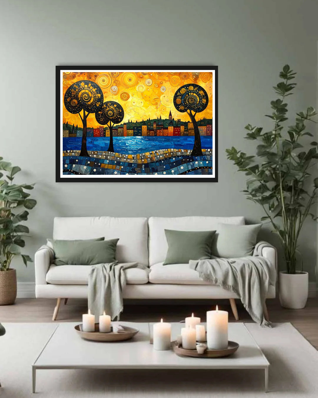Framed abstract artwork above a white sofa in a living room with candles on a coffee table.
