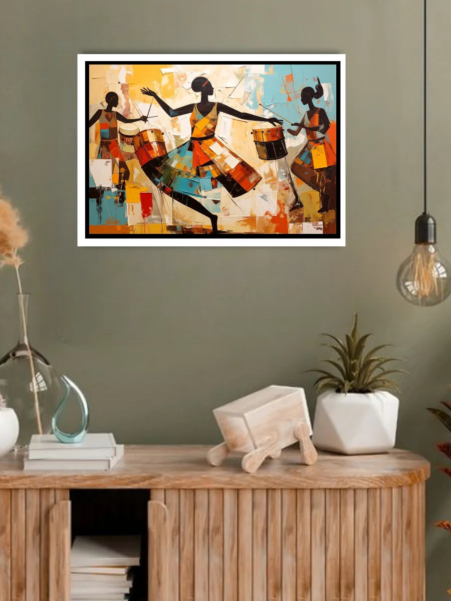 Framed abstract artwork of three figures on a wall above a wooden console table with decorative items.