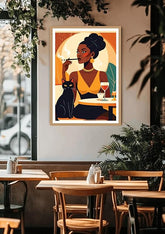 Framed artwork of a woman with a cat in a cafe setting