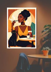 Framed artwork of a woman with a black cat, smoking a cigarette and holding a glass, on a wall.