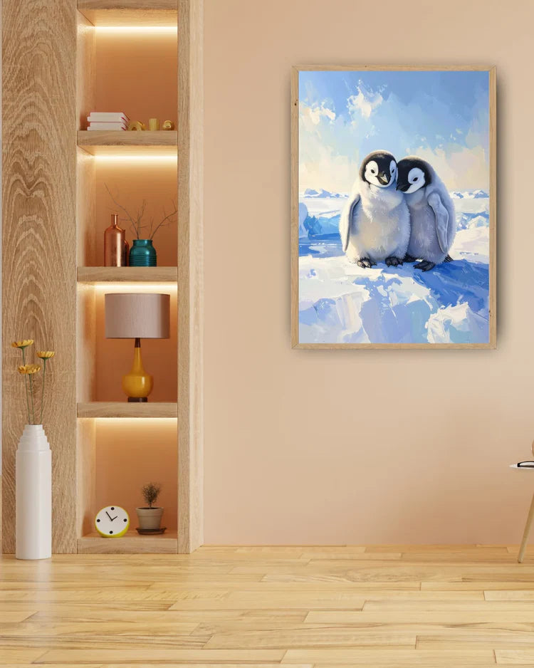 Framed artwork of two penguins on a snowy landscape in a room with wooden floor and shelves.