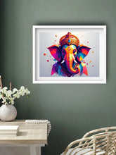 Framed colorful artwork of a deity head on a green wall above a table with decor items.