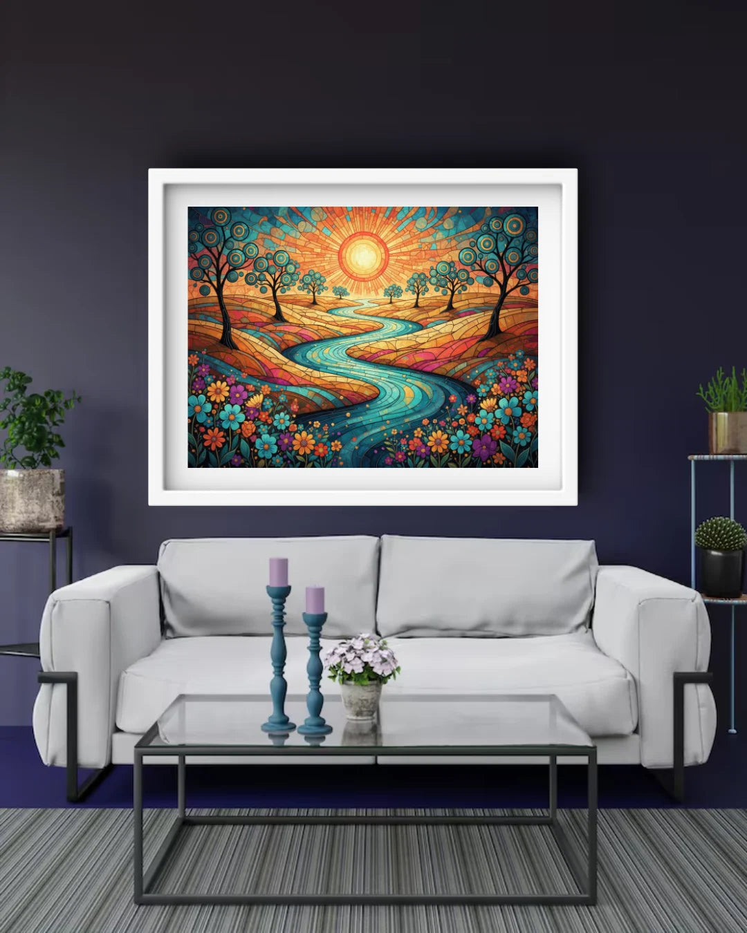 Framed colorful landscape painting above a white sofa in a living room.