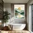 Modern bathroom with a freestanding bathtub, plant, and wall art of a landscape with trees and a sun.