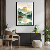 Framed landscape artwork above a table with plants in a room setting