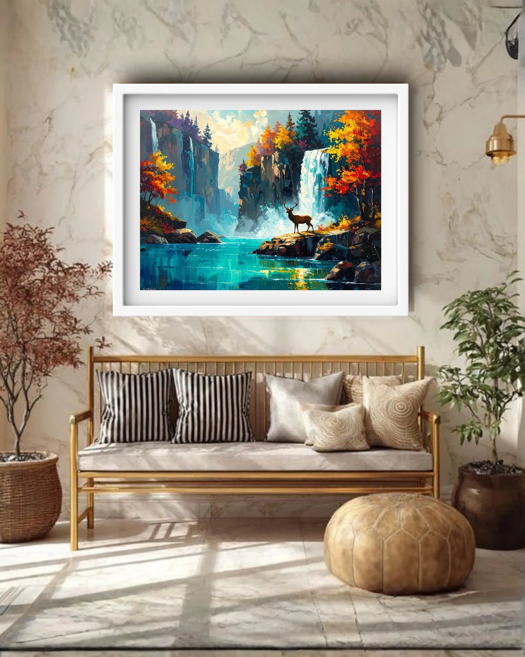 Framed landscape painting above a wooden bench with decorative pillows in a room with marble walls and plants.