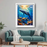 Framed underwater painting of a whale and sea creatures above a teal sofa.