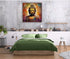 Golden Buddha painting displayed above a green bedding setup in a modern bedroom interior.