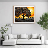 Framed abstract artwork of a tree with a sunset background in a living room.