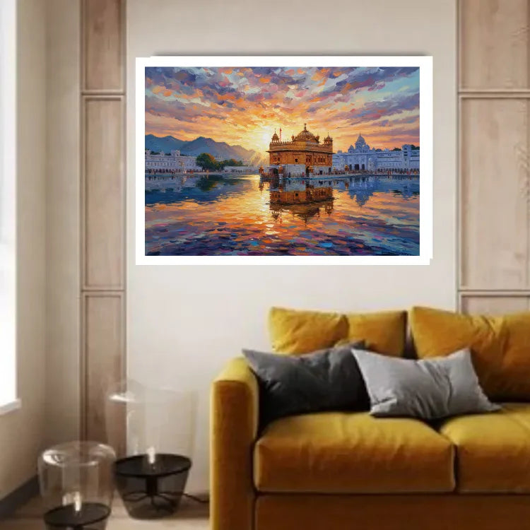 A framed wall art print depicting a colorful sunrise over a golden temple and reflective water, displayed above a mustard yellow sofa in a modern living room setting.