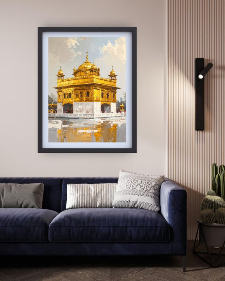 A framed art print of the Golden Temple in Amritsar, displayed on a beige wall above a dark blue velvet sofa in a modern living room setting.