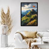 A framed art print depicting the Great Wall of China on a green hill under a cloudy sky with an orange flag, displayed on a white wall above a white sofa in a modern living room setting.