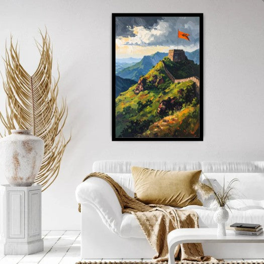 A framed art print depicting the Great Wall of China on a green hill under a cloudy sky with an orange flag, displayed on a white wall above a white sofa in a modern living room setting.