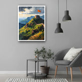 Living room with a painting of the Great Wall of China on the wall, a gray armchair, and a small round table.