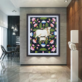 Decorative wall art with a cow and floral design in a modern interior setting.