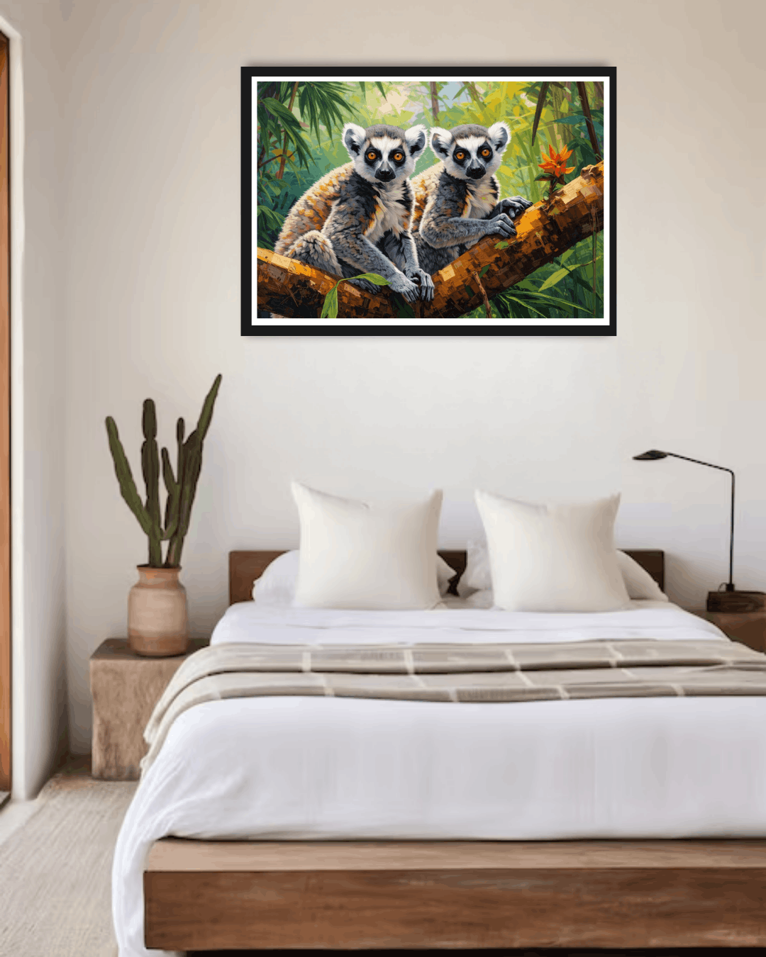 Framed artwork of two lemurs on a branch above a bed in a bedroom.