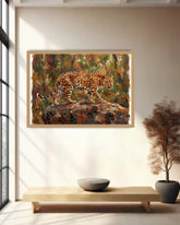 Framed cheetah wildlife canvas painting displayed in a modern minimalist living room with natural sunlight