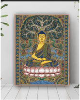 Colorful tapestry with a Buddha design on a white wall.