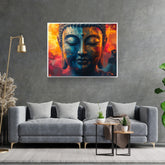 Modern Buddha art canvas mounted above a grey sofa in a contemporary living room.