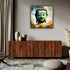 Modern Buddha canvas painting displayed above a wooden sideboard in a contemporary living room.