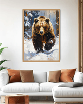 Framed artwork of a bear in a snowy landscape above a white sofa with brown and orange cushions.