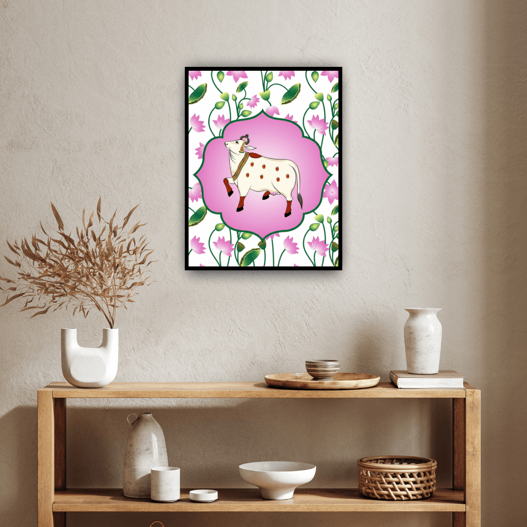 Framed artwork of a cow with flowers on a wall above a wooden shelf with decorative items.
