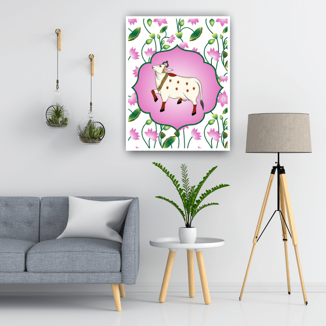 Living room with a gray sofa, lamp, and decorative wall art featuring a cow and flowers.