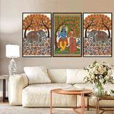 Decorative wall art featuring elephants and traditional figures in a living room setting.
