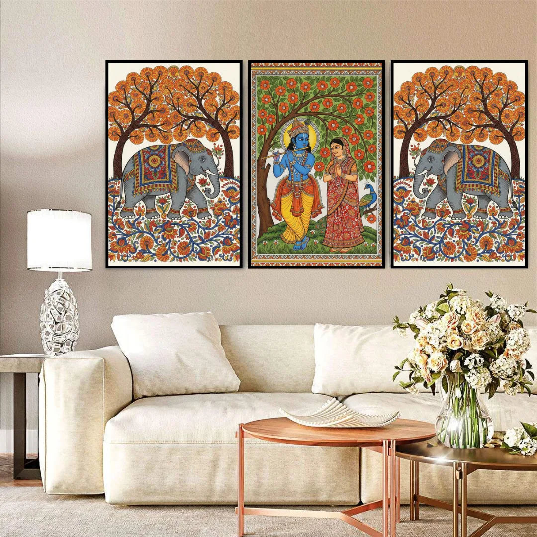 Decorative wall art featuring elephants and traditional figures in a living room setting.