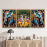 Three framed artworks of elephants and a couple on a wall above a decorative cabinet.