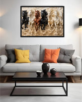 Living room with a gray sofa, colorful pillows, and a framed artwork of running horses on the wall.