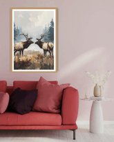 Framed artwork of two elk in a forest scene above a red sofa with pink and black cushions.