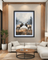 Framed artwork of two elk on a wall above a sofa in a living room.